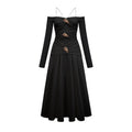 Vestido maxi negro de manga larga y hombros descubiertos de la marca Final Sale, con paneles y diseño elegante.