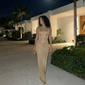 Vestido largo sin espalda de SLIPPO® Corliss con abertura y detalles embellidos, ideal para ocasiones de vacaciones.