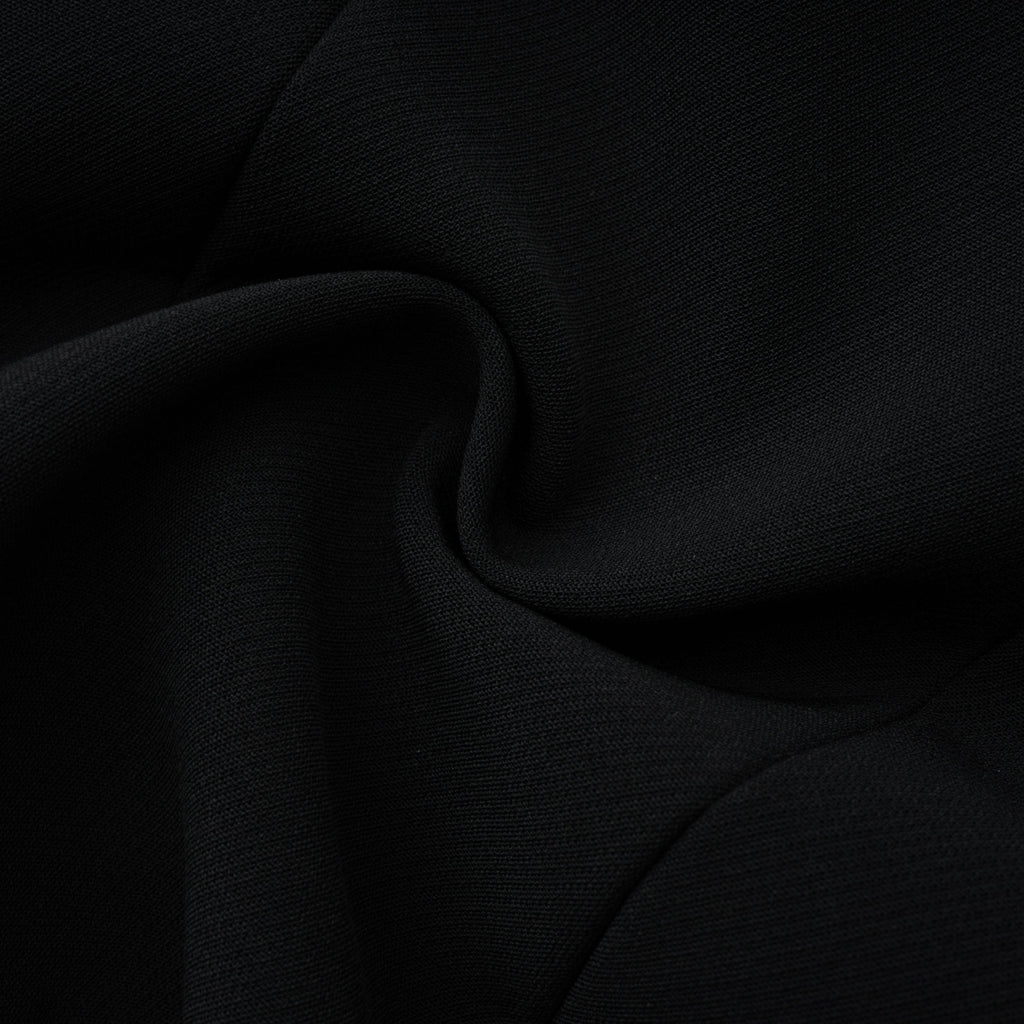 Blazer negro con paneles de encaje floral de Bridal, estilo elegante y sofisticado para ocasiones formales.
