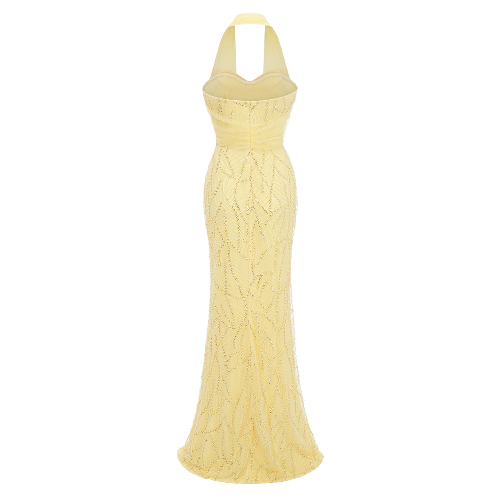 Vestido maxi amarillo con lazo en halter de MRNewyork, estilo elegante y cómodo para ocasiones especiales, con acabado en falda larga.