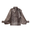 Blusa oversize con mangas largas de estampado leopardo de la marca Final Sale, mostrando el diseño y tela.