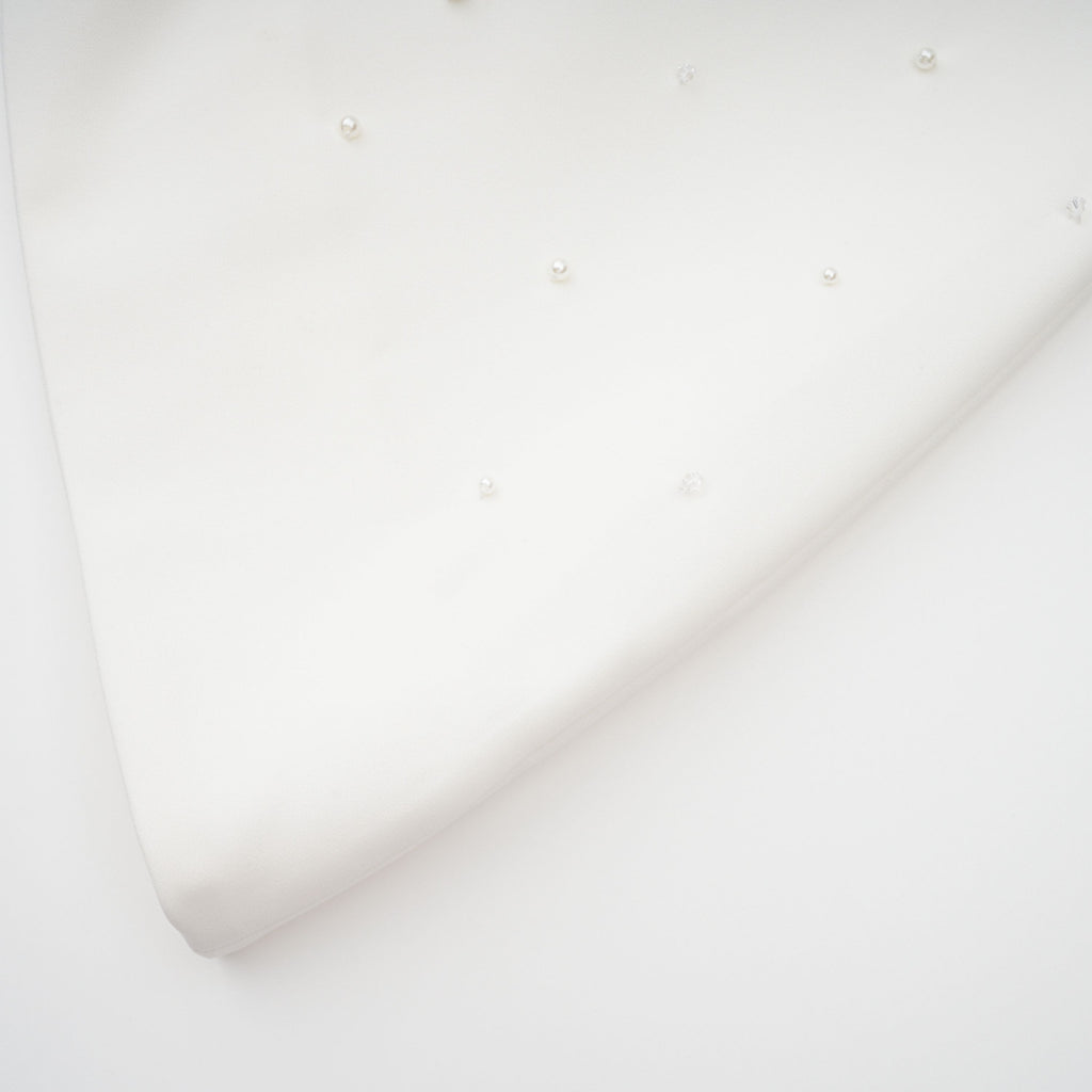 Conjunto de vestido y falda blancos de novia Melisande con detalles adornados, diseñado por Bridal.
