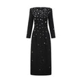 Vestido largo negro Imelda con cristales adornados, estilo maxi, exhibido en la imagen con detalles elegantes y diseño sofisticado