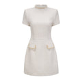 Vestido mini de tweed blanco con adornos, estilo Jeanne, de la marca Final Sale, mostrando detalles y textura del tejido.