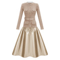 Vestido midi de punto satinado Fern Gold de la marca Final Sale, con paneles en tonos dorados y diseño elegante.