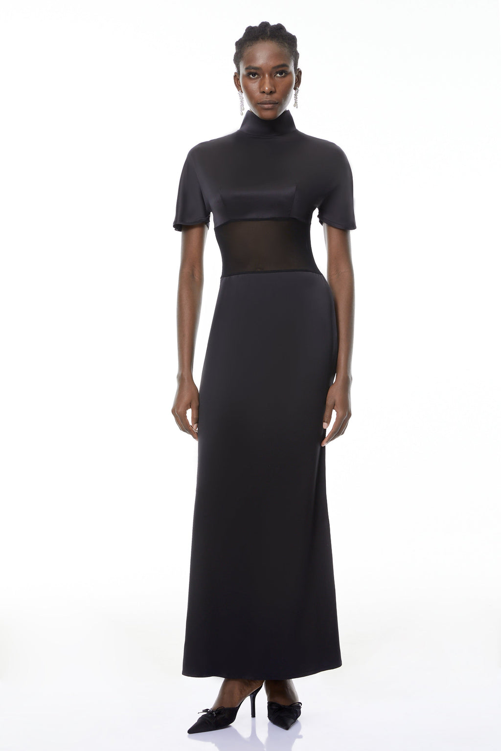 Vestido maxi negro Odelia de manga larga con cuello alto y tela transparente, de la marca MRTokyo.
