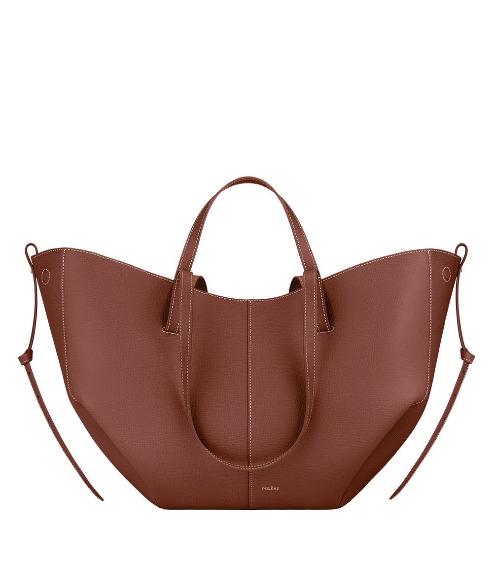 Bolso de mano Polène Cyme en piel granulada color coñac, vista frontal del diseño y textura.
